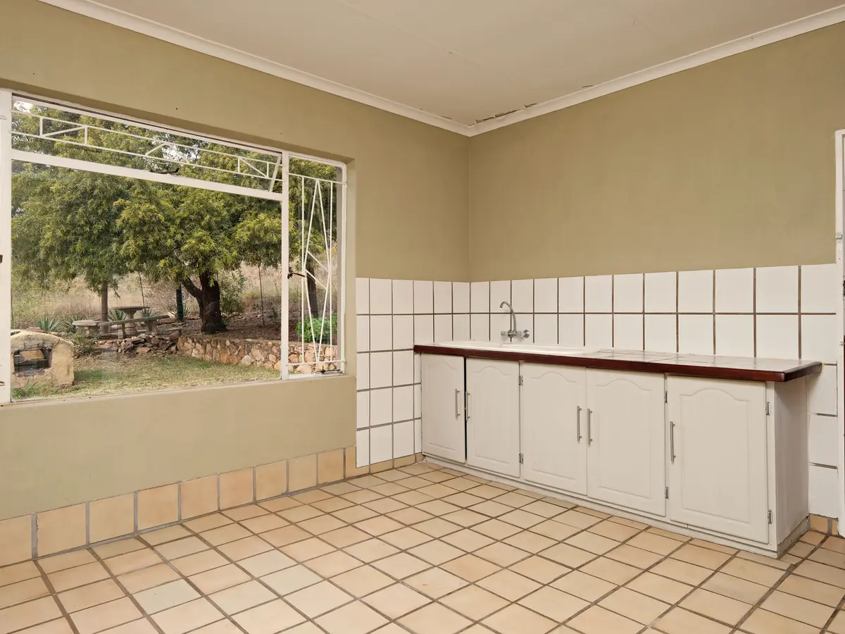 Original photo of the kitchen before its industrial redesign preview